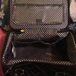 USED- A MAKEUP BAG AND CAN BE USED AS A TRAVEL BAG